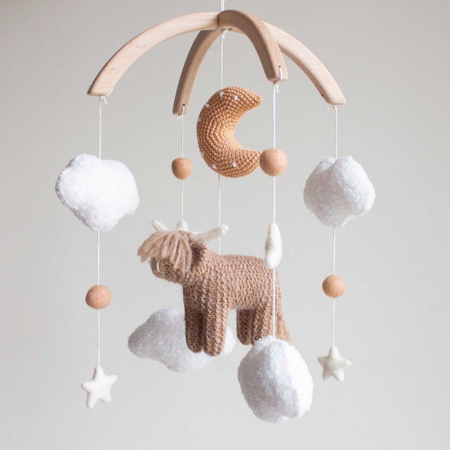 Highland cow baby mobile with boucle clouds, moon in earthy browns