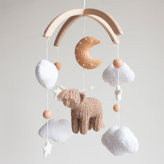 Highland cow baby mobile with boucle clouds, moon in earthy browns