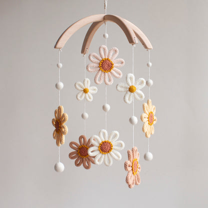 Whimsical sunflower nursery mobile hanging in a bright, botanical-themed room above a white crib. Bright and cheerful baby shower gift—artisan sunflower mobile handcrafted in Northern Ireland.