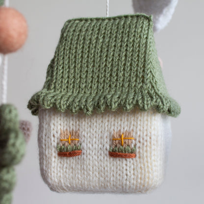 Rustic farmhouse nursery mobile perfect for hanging in a neutral-toned baby room with wooden accents.