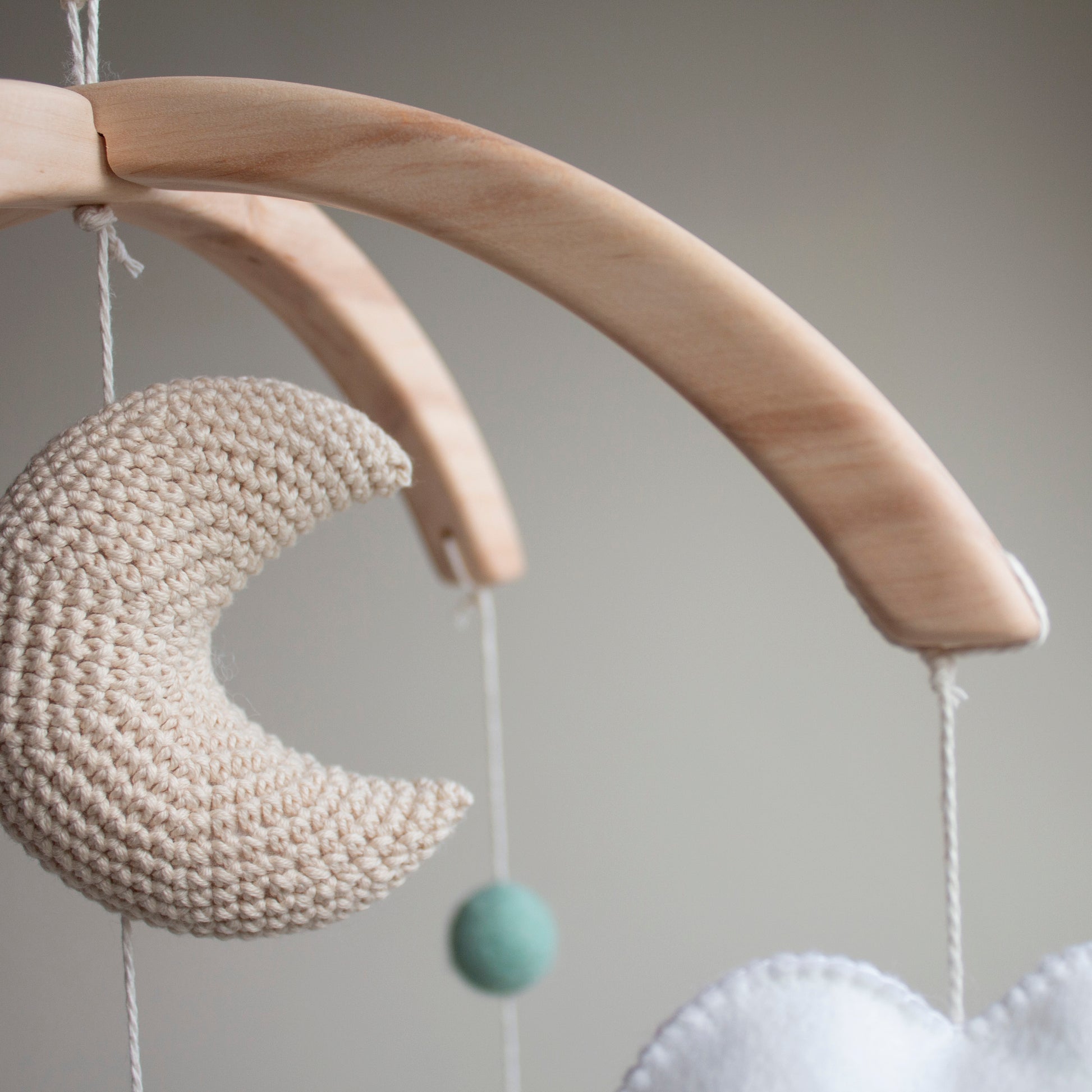 Wooden baby mobile arch made of untreated wood and hand-sanded to be silky smooth