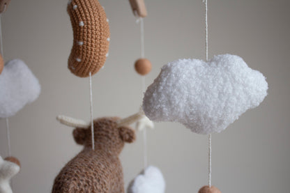 Highland cow baby mobile with boucle clouds, moon in earthy browns