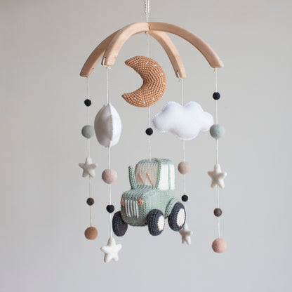Artisan tractor baby mobile—a unique baby shower gift for vehicle-loving families and rustic nurseries.