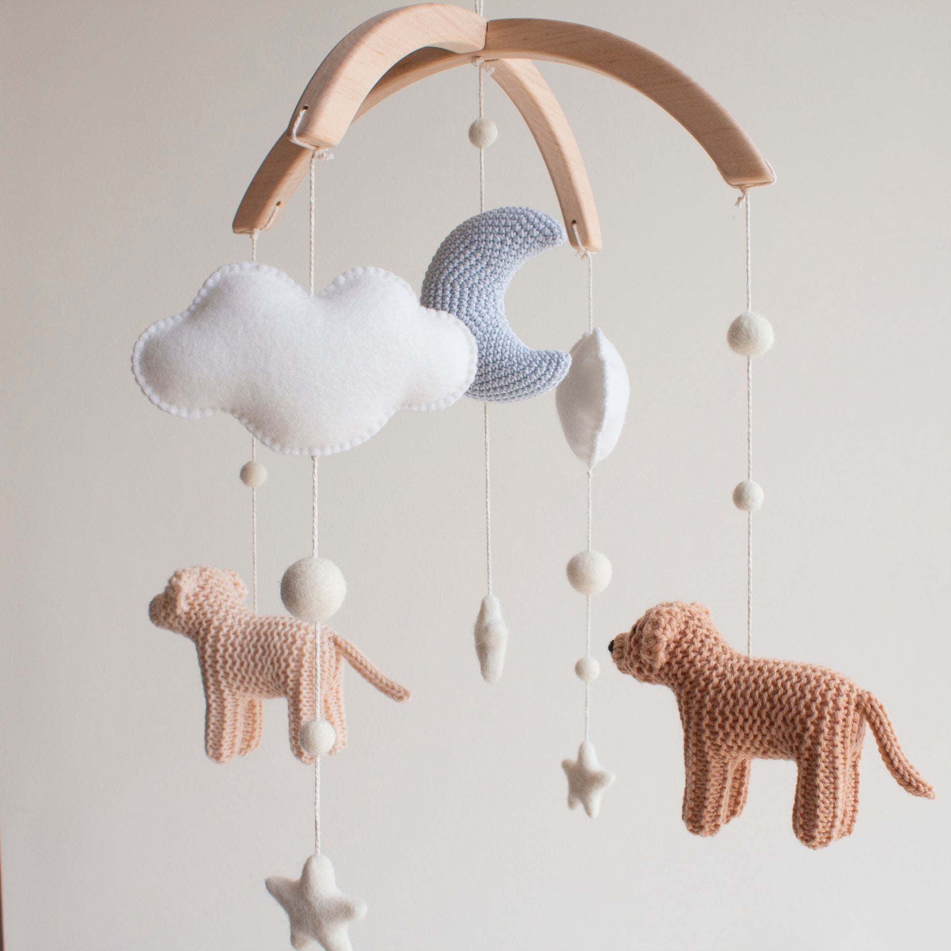 Baby mobile with crocheted soft sky blue moon, light brown animals, white clouds, and stars for scandi, minimalistic nursery