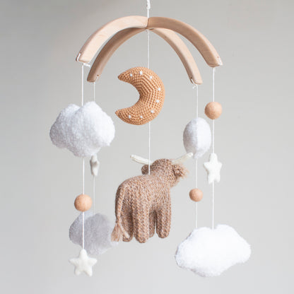 Highland cow baby mobile with boucle clouds, moon in earthy browns