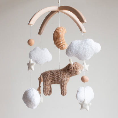 Highland cow baby mobile with boucle clouds, moon in earthy browns