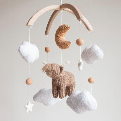 Highland cow baby mobile with boucle clouds, moon in earthy browns