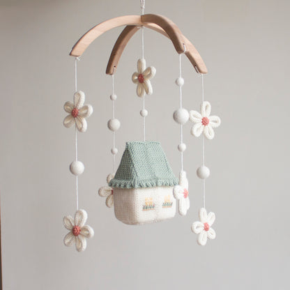 Sustainable alder wood mobile frame with handmade wool balls and cotton hanging string.