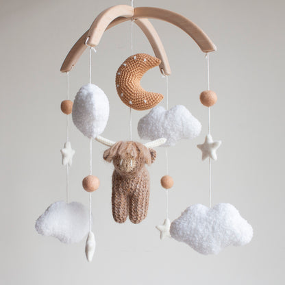 Highland cow baby mobile with boucle clouds, moon in earthy browns