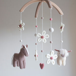 Cottagecore nursery mobile with highland cow, horse, daisies