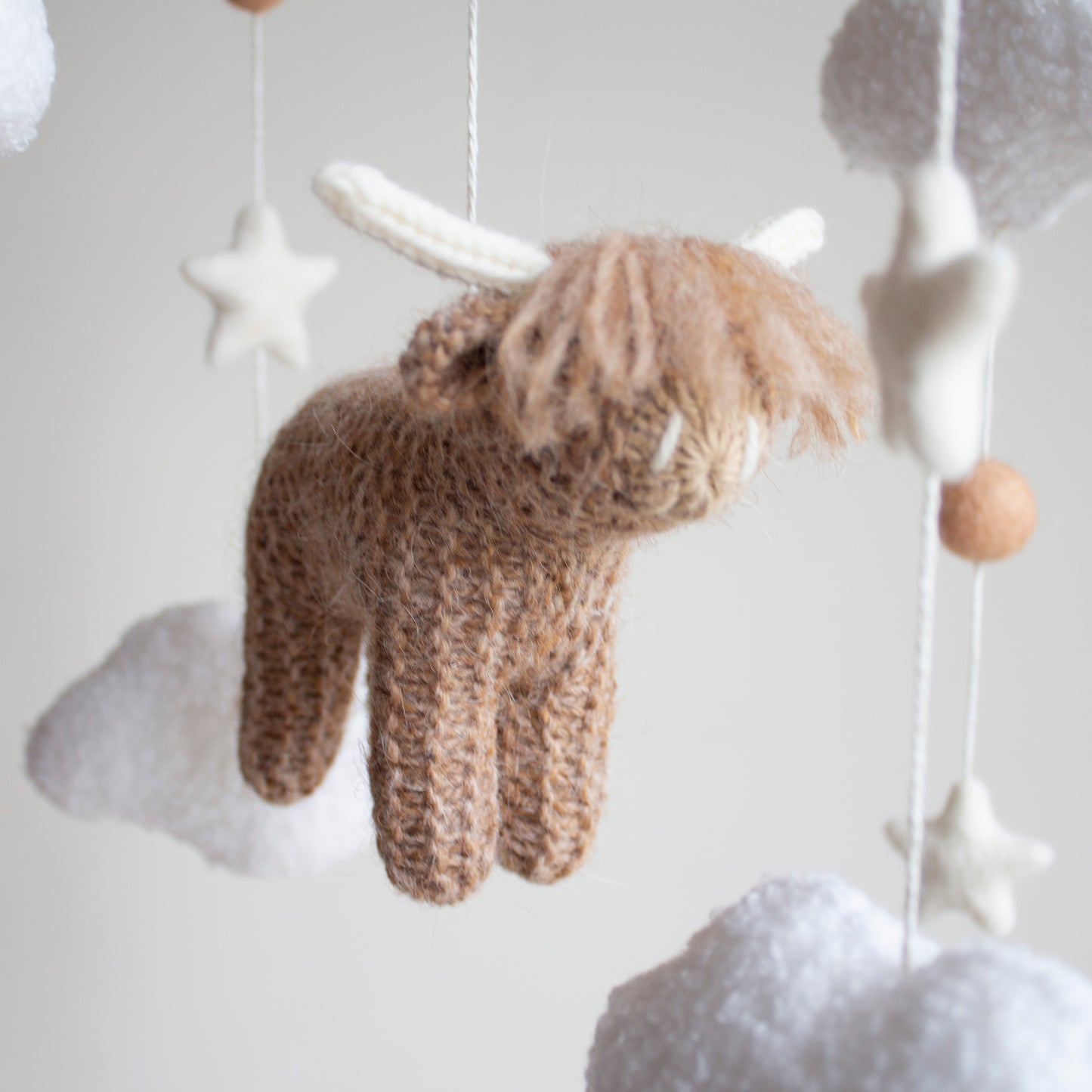 Highland cow baby mobile with boucle clouds, moon in earthy browns